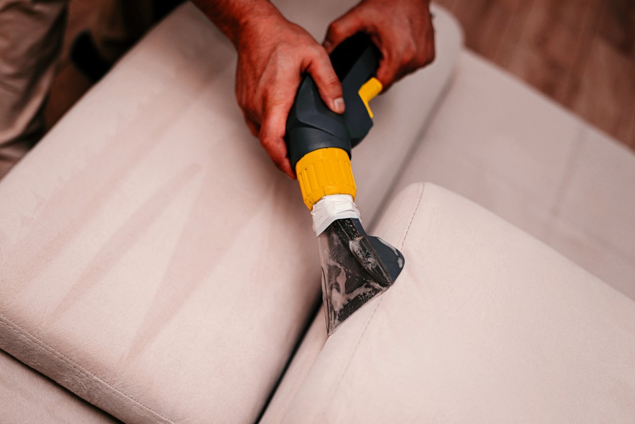 Cleaning a  sofa with a sofa washer